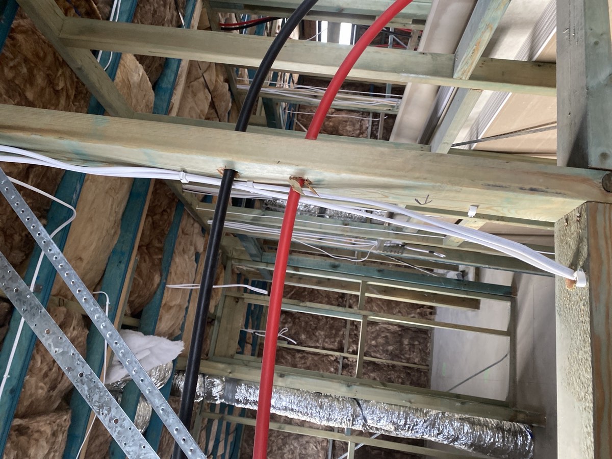 Cable against a hot water pipe, Box Hill