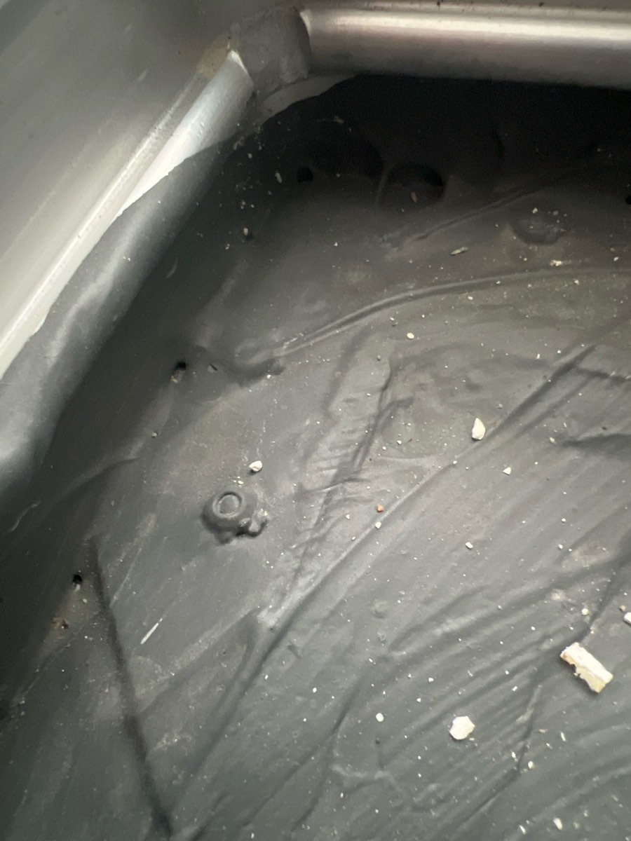 Pinholes to a shower hob membrane, recorded during a waterproofing inspection in Box Hill
